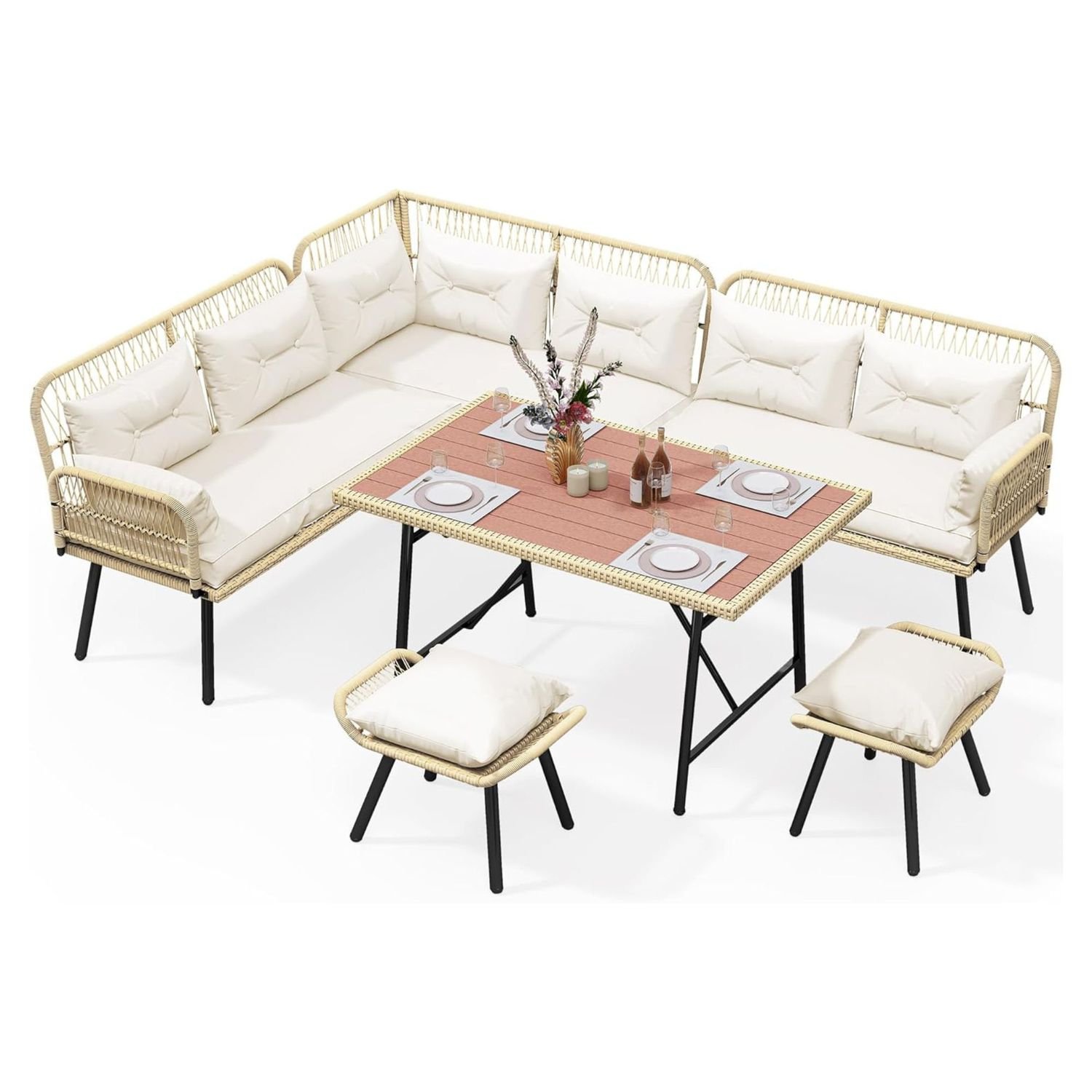 A set of rattan patio furniture with white cushions