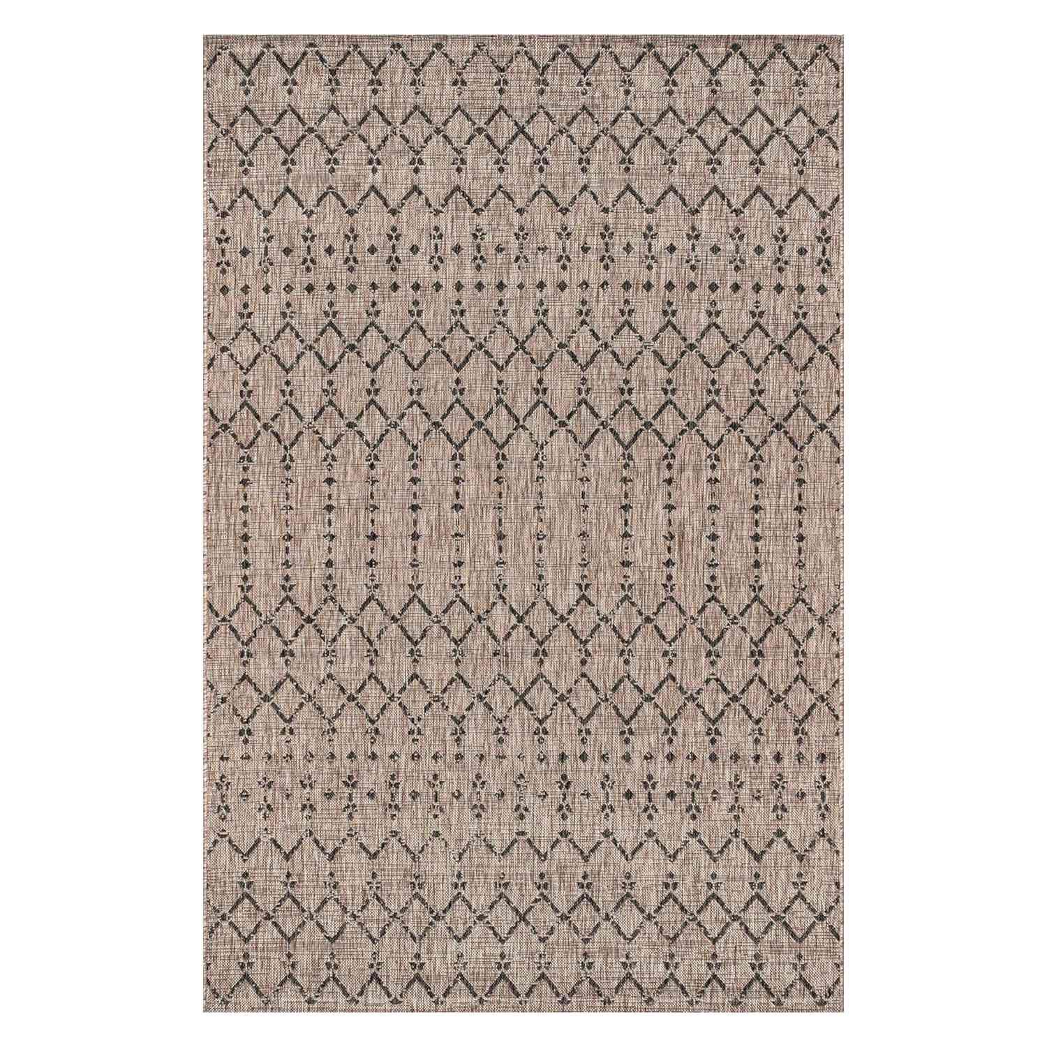 A geometric patterned neutral woven area rug