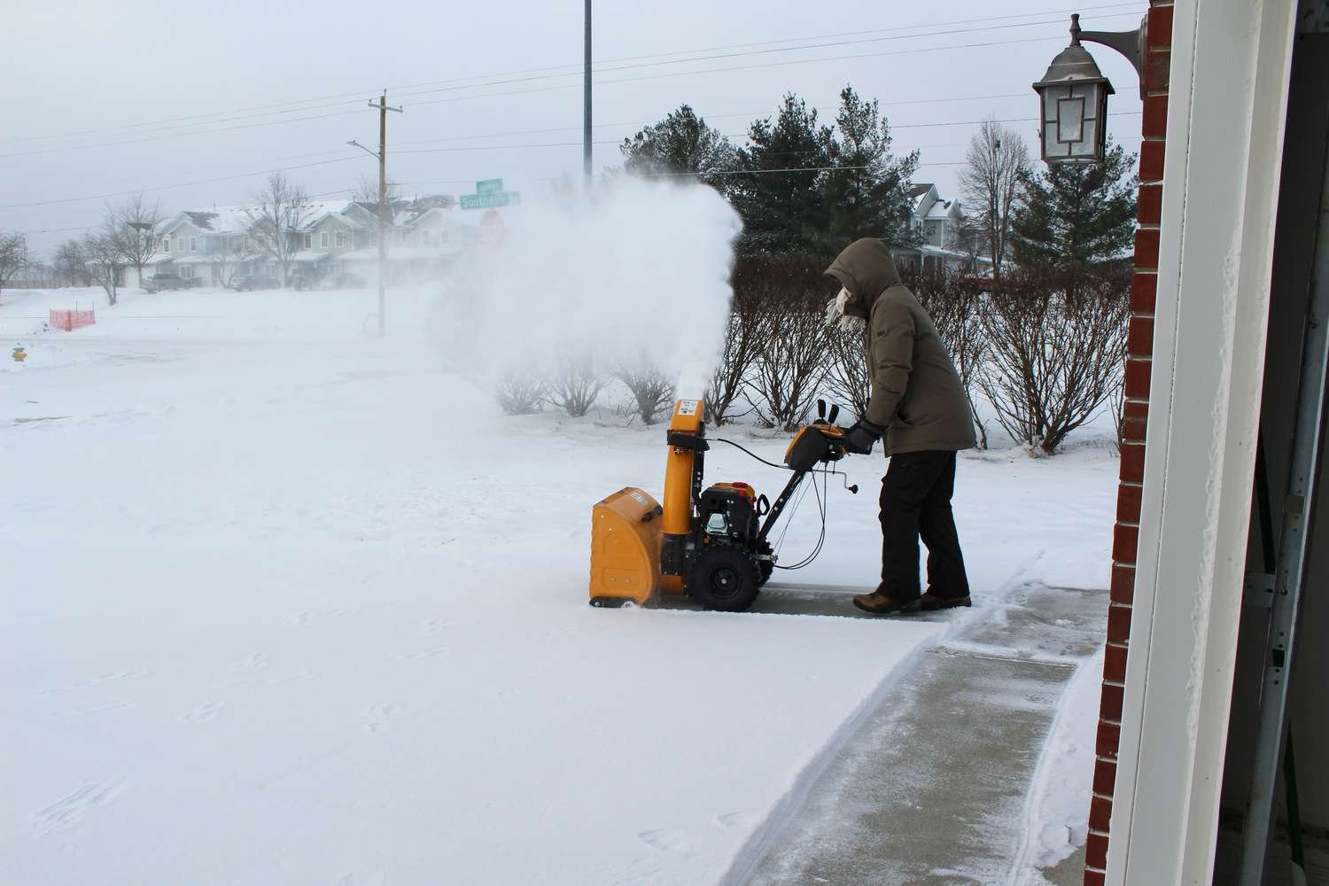 Person removing snow using the powerful Cub Cadet 2X 26 Inch IntelliPower Snow Blower