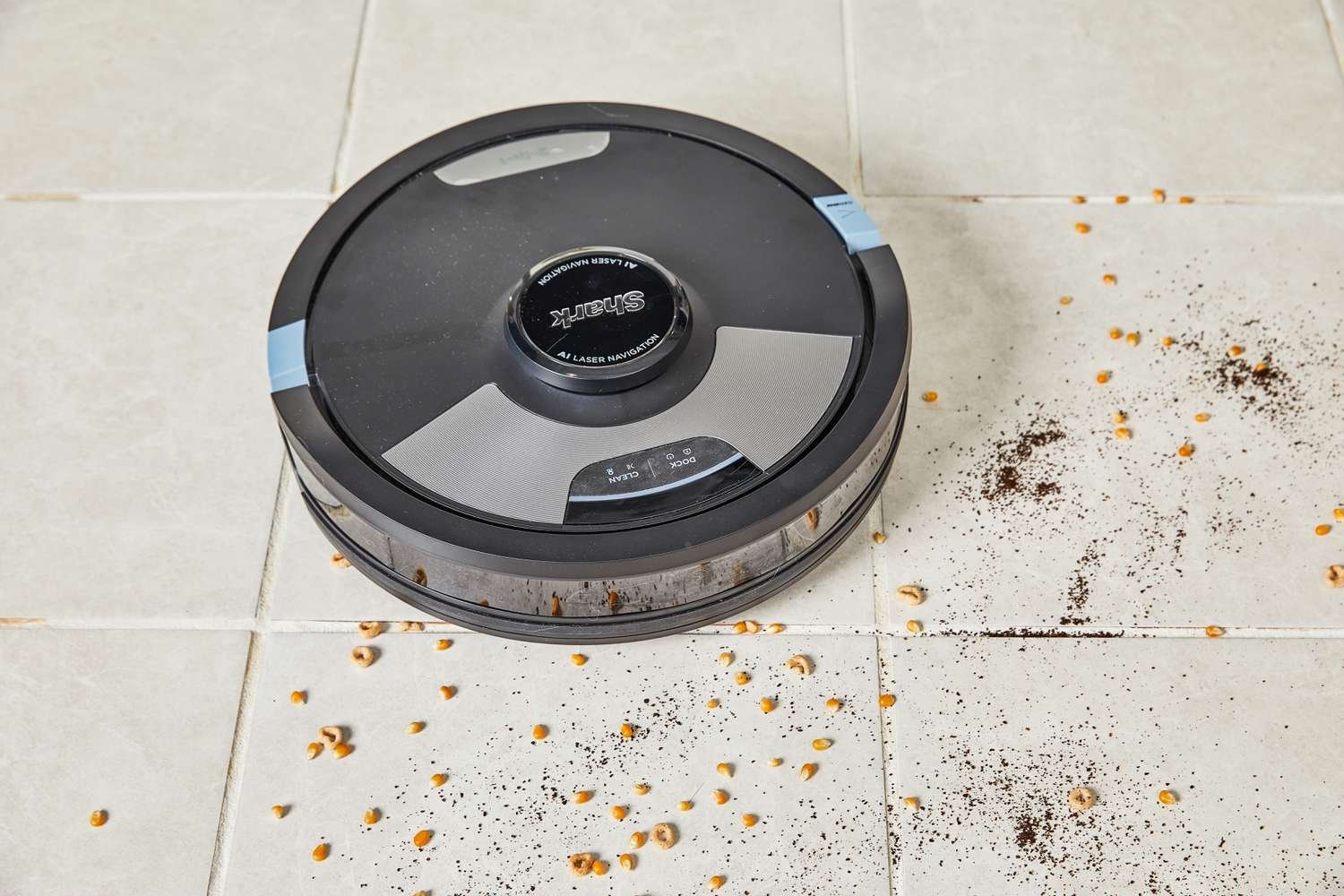 Shark AI Ultra 2-in-1 Robot Vacuum & Mop cleaning food and dirt from tile floor