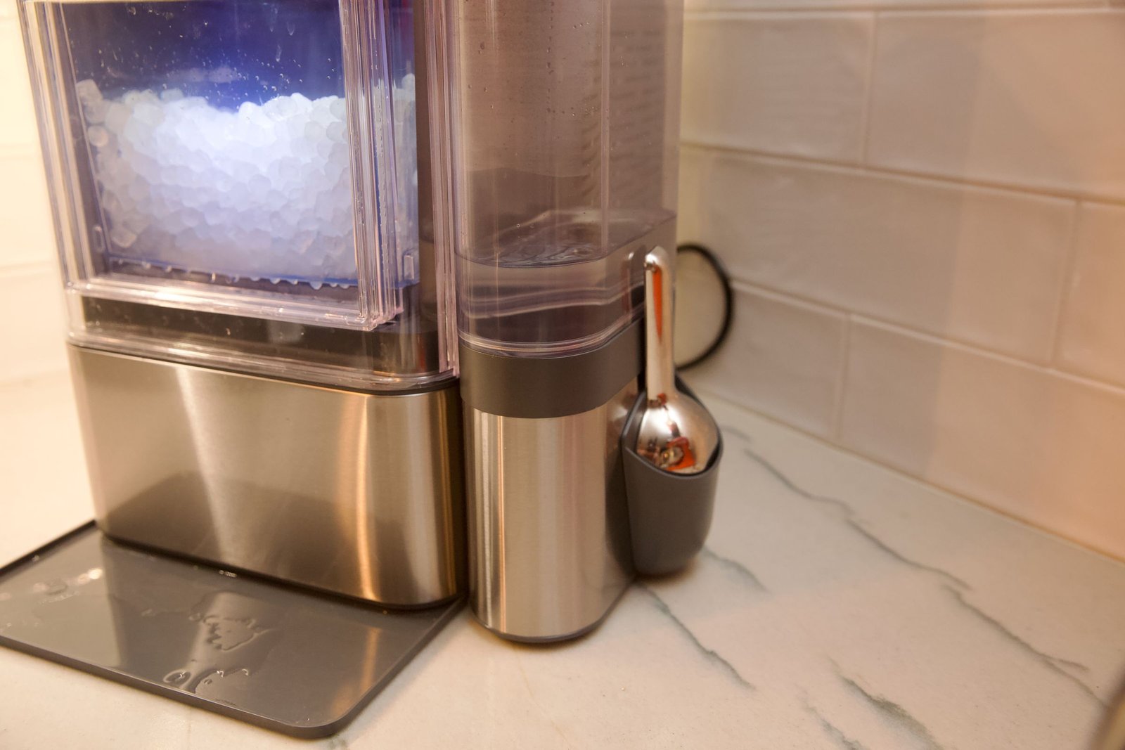 Upgrades with the Ultra include a magnetic scoop holder and a stainless steel scoop.