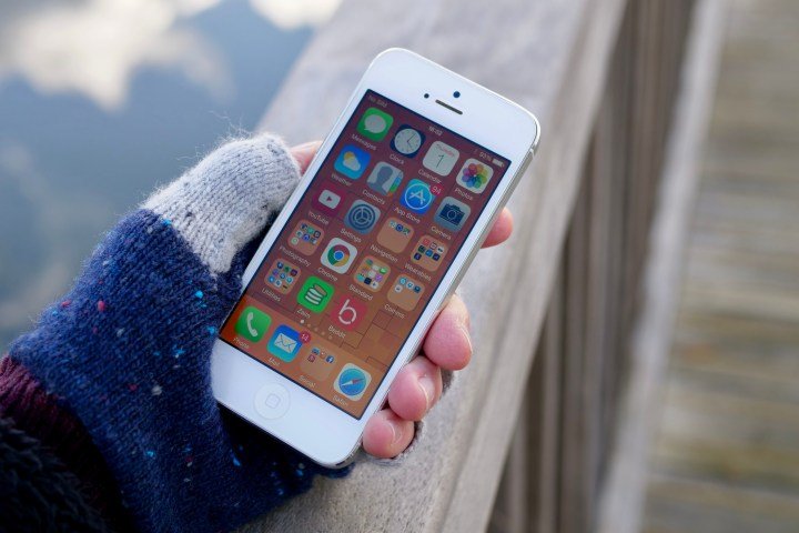 A person holding the iPhone 5.