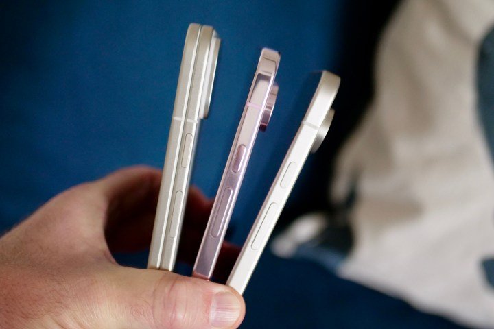 A person holding the Google Pixel 9 Pro Fold, Pixel 9 Pro, and Pixel 9, showing the sides.
