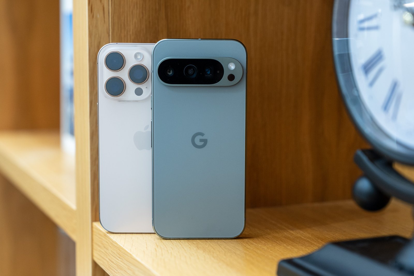 Hero photo of the back of the iPhone 16 Pro and Pixel 9 Pro