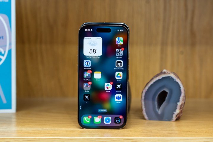 The iPhone 16 Pro in front of the Pixel 9 Pro showing the small differences in height and width.