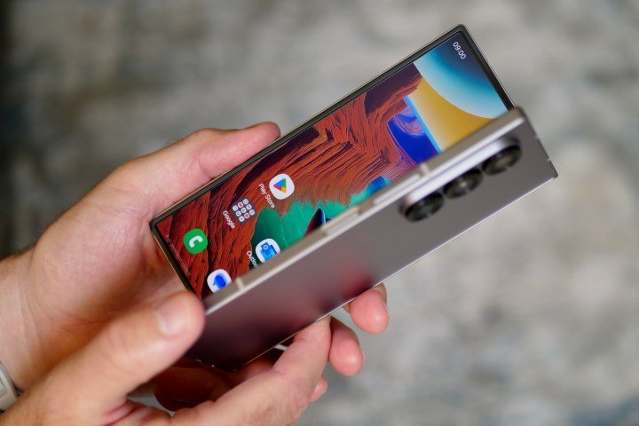 A person opening the Samsung Galaxy Z Fold 6.