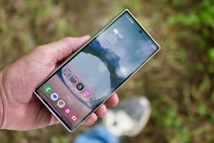 A person holding a closed Samsung Galaxy Z Fold 6.