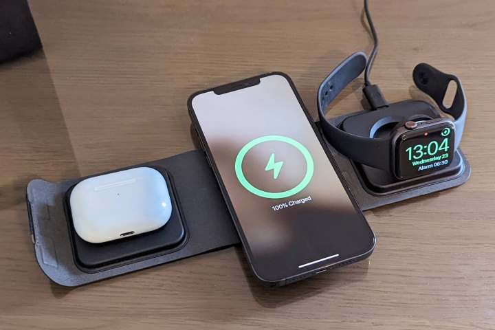 Mophie 3-in-1 MagSafe travel charger with AirPods Pro, iPhone 12 Pro Max, and Apple Watch placed on top.