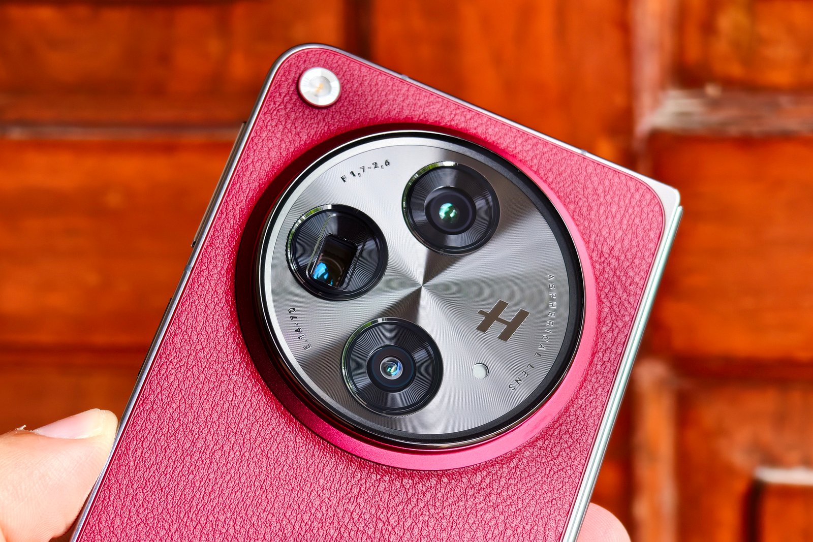 Close up of the camera module on the OnePlus Open Apex Edition Crimson Shadow red.