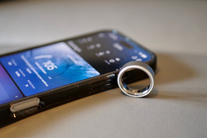 The Oura Ring 4 alongside the Apple iPhone 16 Pro Max.