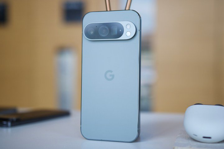 The Google Pixel 9 Pro standing upright on a table.