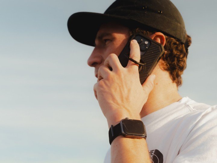 Man using Rokform's bestselling case while on a phone call