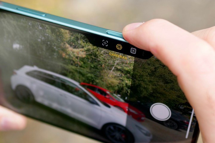 A person using the Camera Control on the Apple iPhone 16 Plus.
