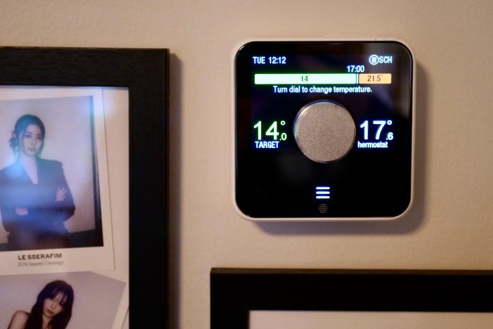 A Hive thermostat on a wall.