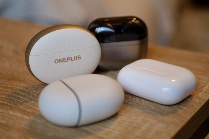 The OnePlus Buds Pro 3, Samsung Galaxy Buds3 Pro, Google Pixel Buds Pro 2, and Apple AirPods Pro 2 in their cases.