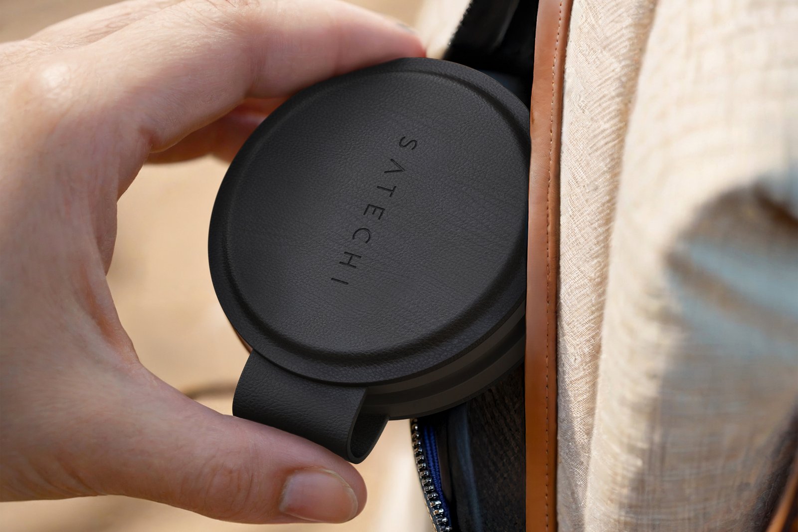 Satechi OntheGo wireless charger coming out of a pocket.