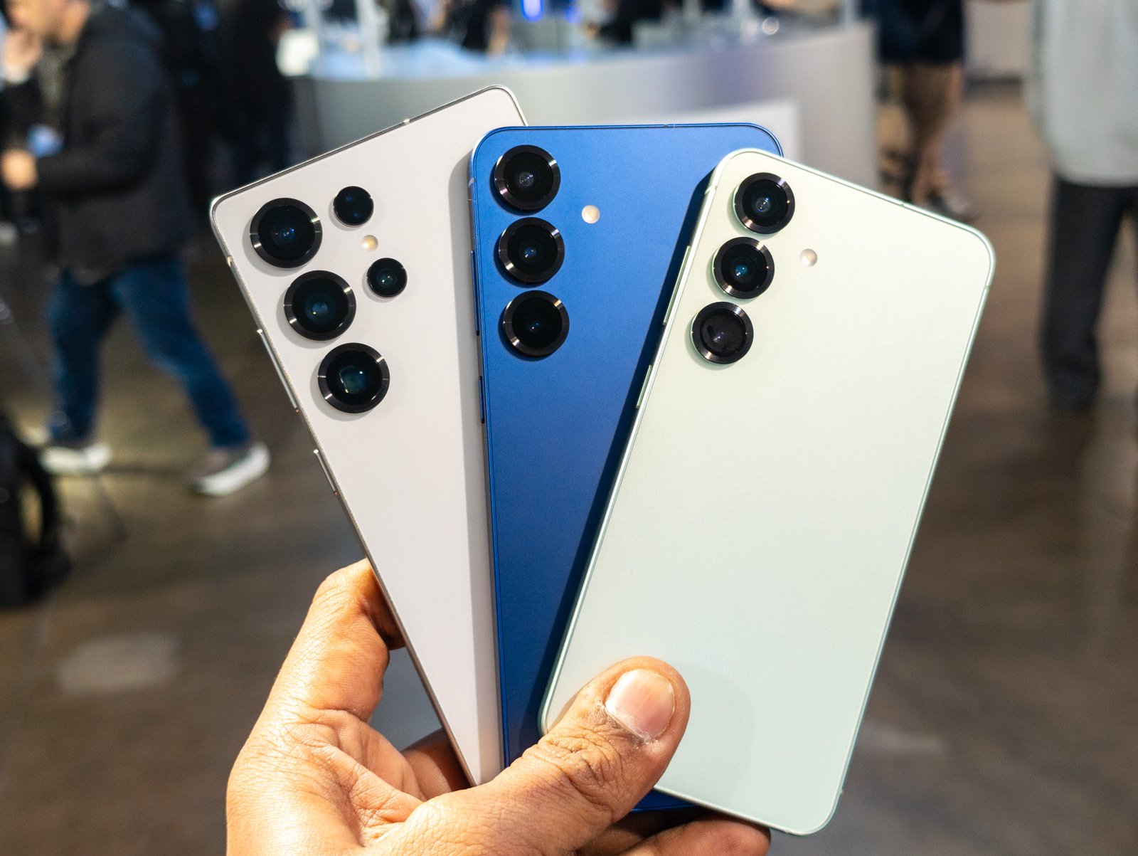 The Samsung Galaxy S25 series in one person's hand.