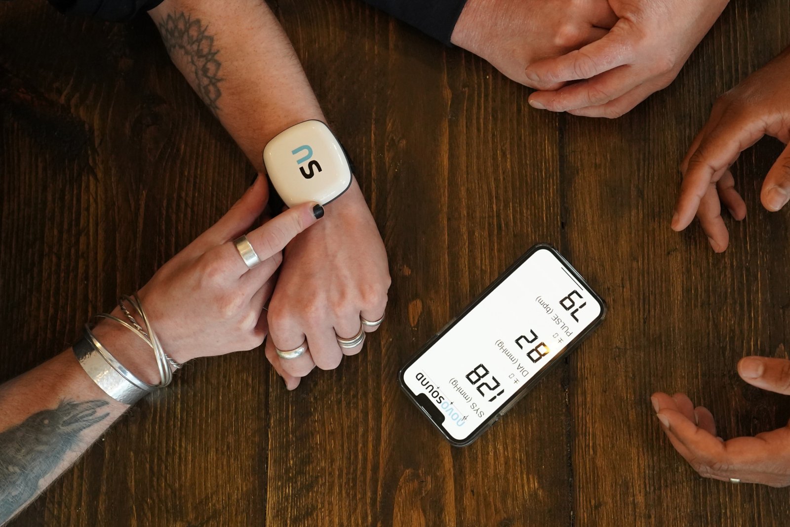 Person wearing Novosound blood pressure wearable.