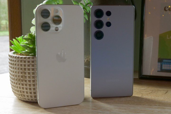 The Samsung Galaxy S25 Ultra and Apple iPhone 16 Pro Max, seen from the back.