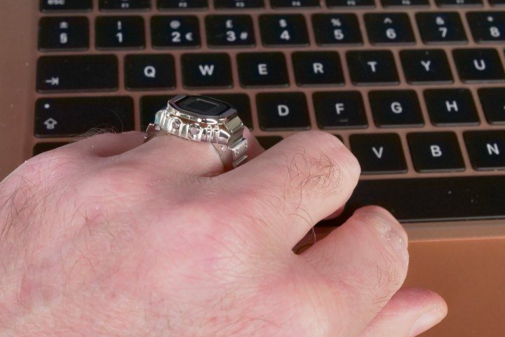 A person wearing the Casio Ring Watch while typing.