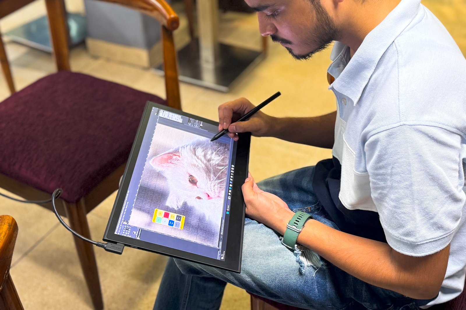 Person sketching on the Wacom Movink tablet.