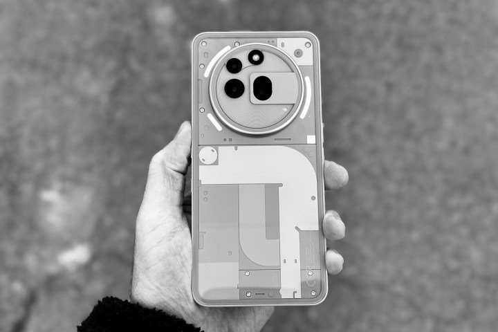 A person holding the Nothing Phone 3a Pro.