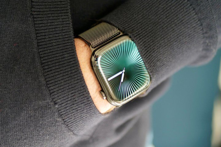 A person wearing the titanium Apple Watch Series 10.
