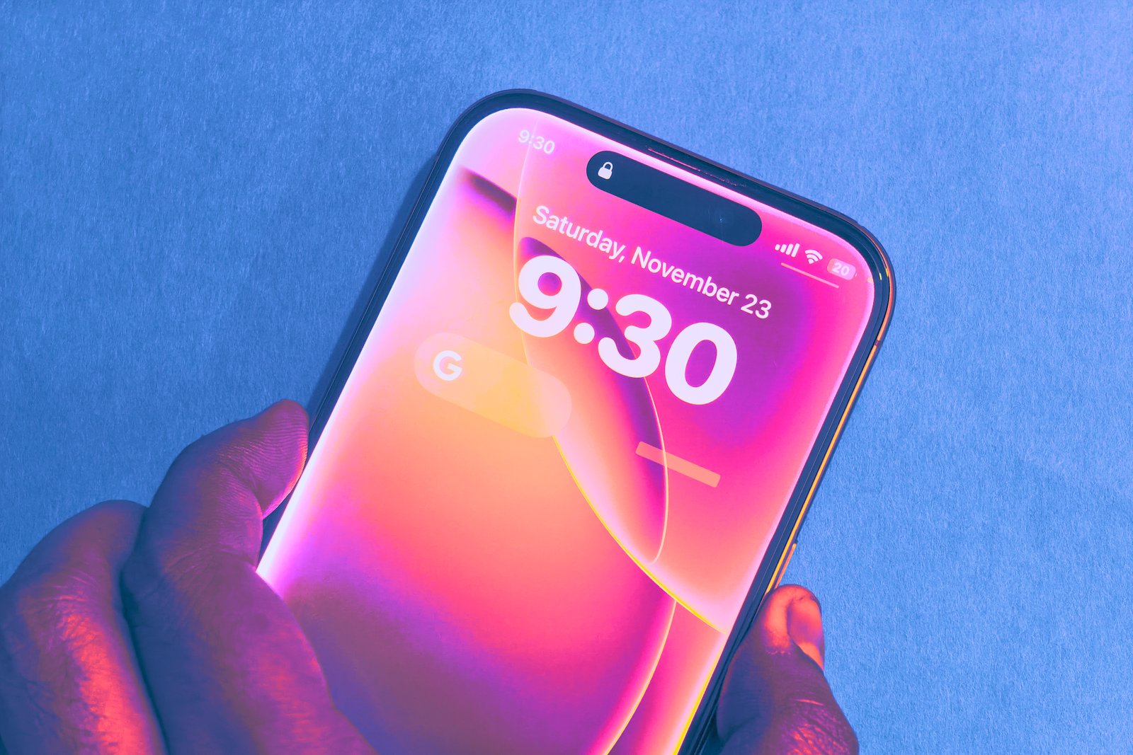 Pulling up Siri on lock screen of iPhone.