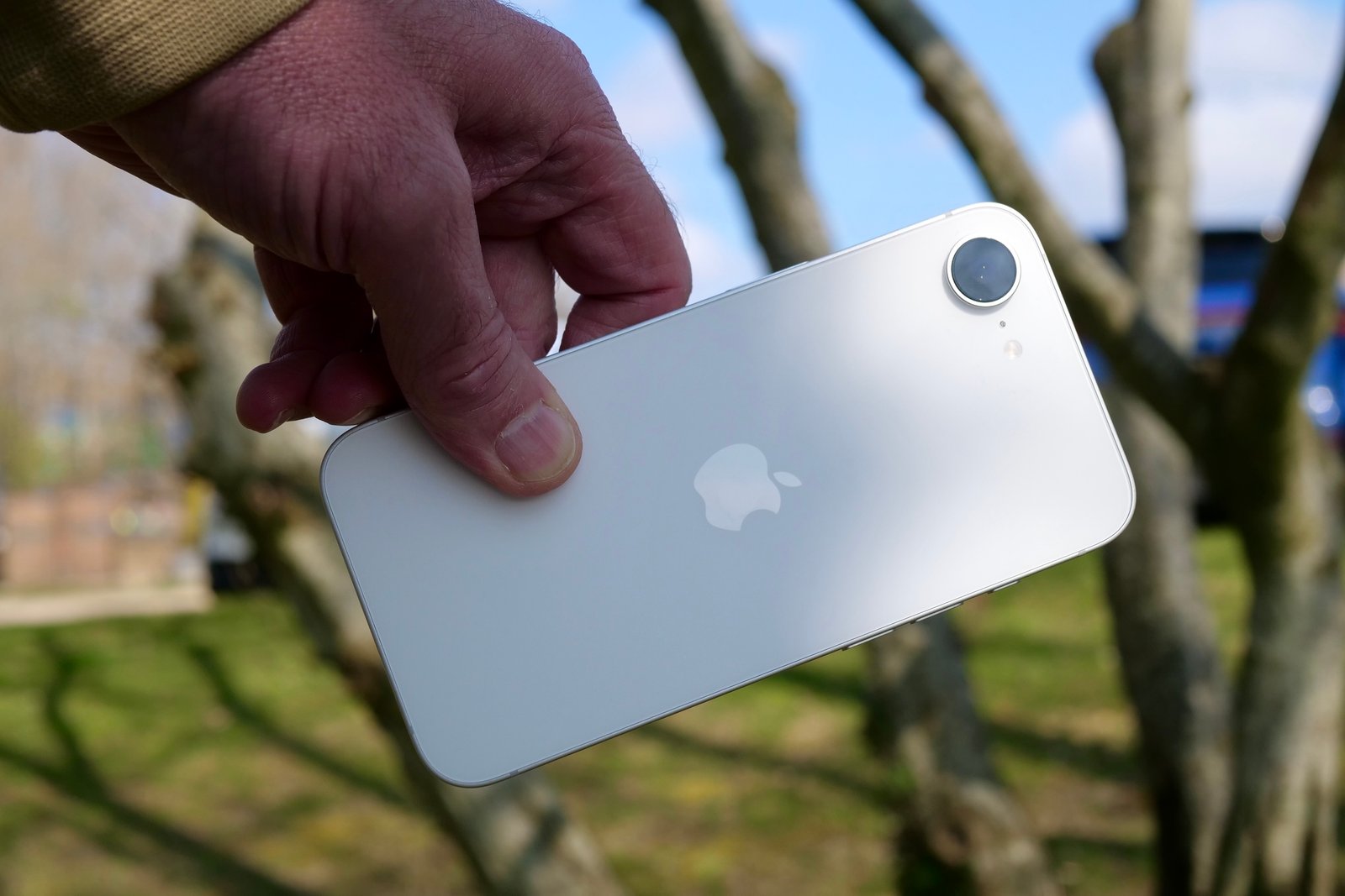 A person holding the Apple iPhone 16e.