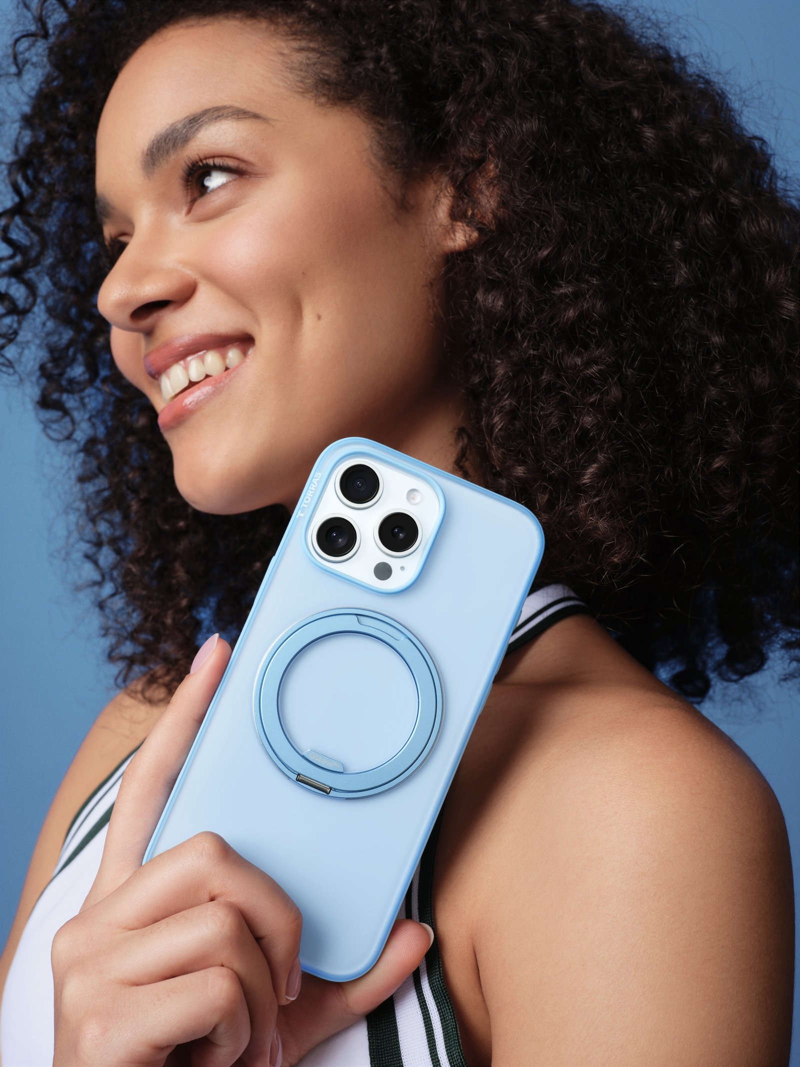 A woman with a TORRAS case on her iPhone.