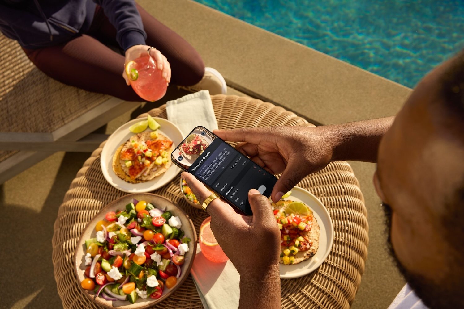 A promotional image for the Oura Ring's Meals feature.