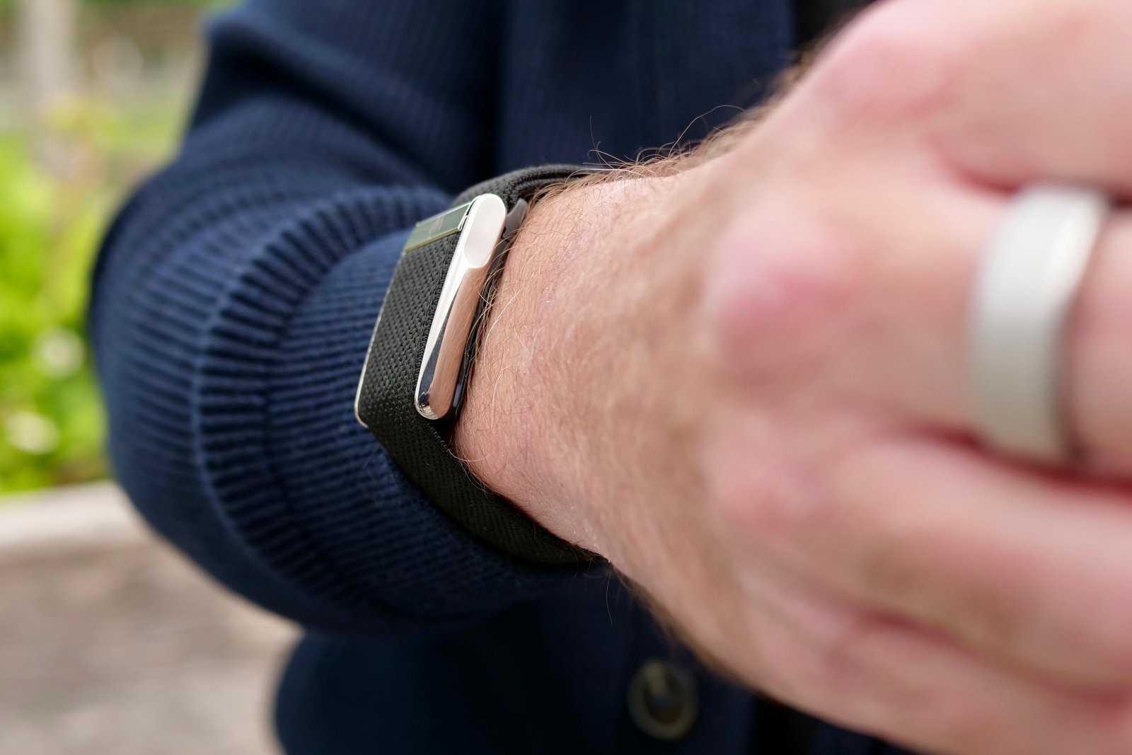 The side of the Whoop 5.0 on a person's wrist.