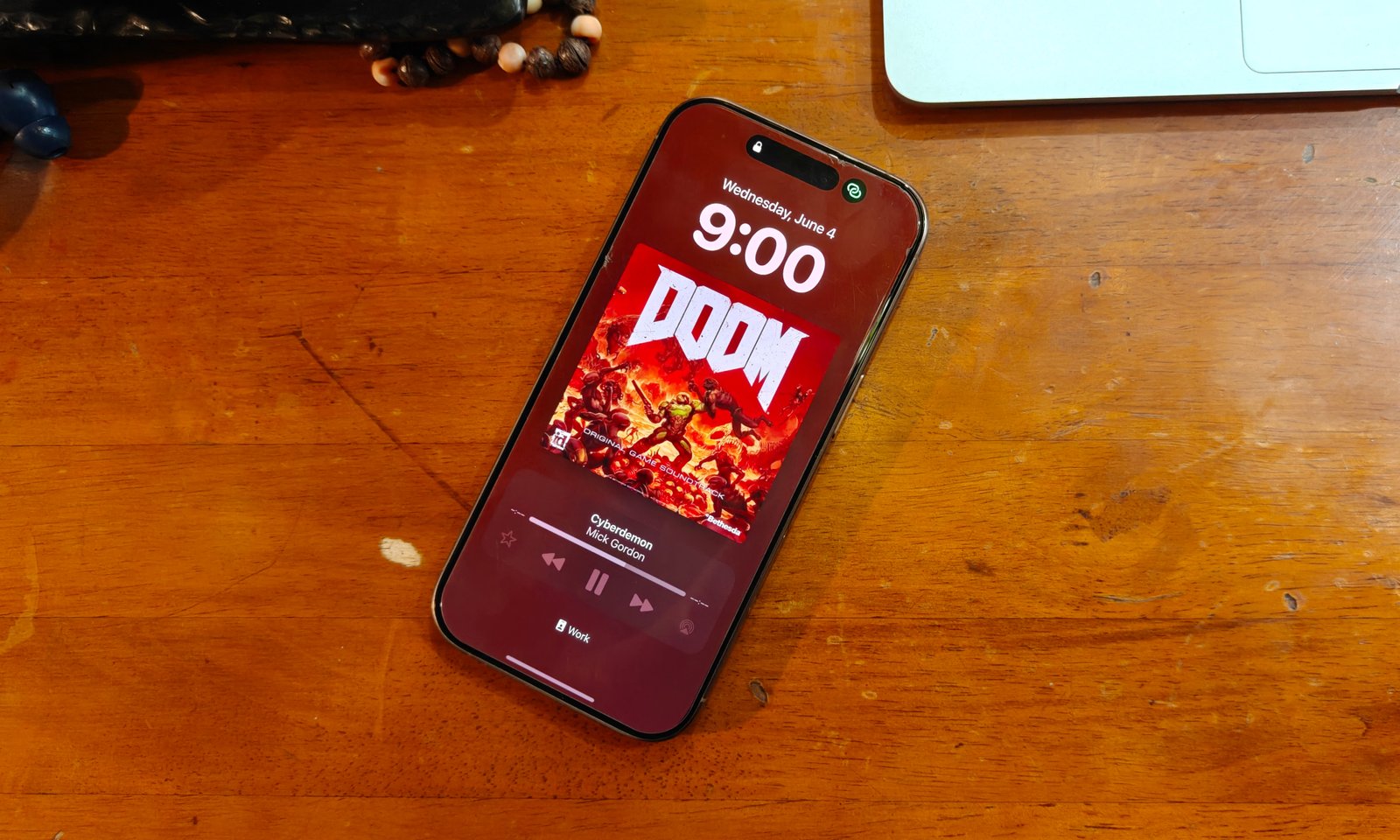 Album cover art on an iPhone's lock screen.
