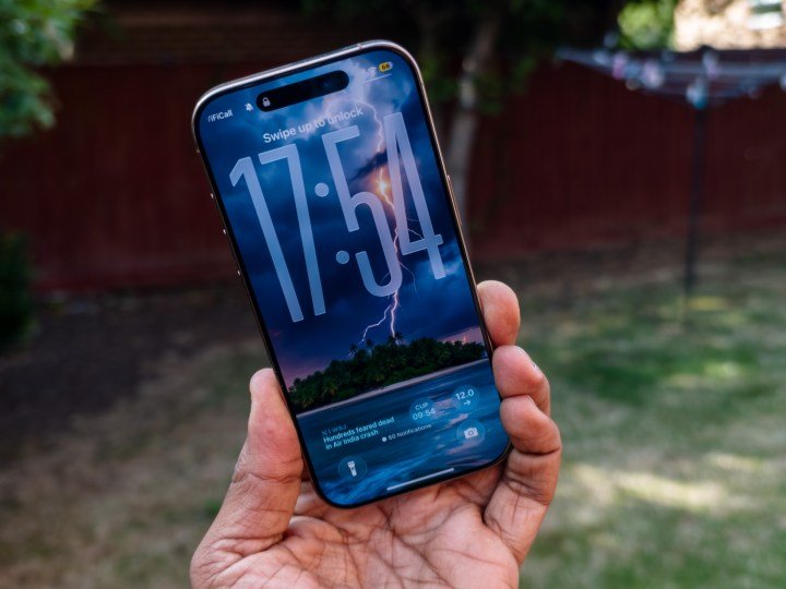 The Liquid Design lock screen on the iOS 26 developer beta 1 running on the iPhone 16 Pro