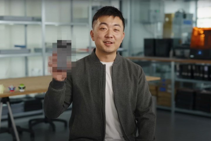 Nothing CEO, Carl Pei holding up a pixelated Phone (3)