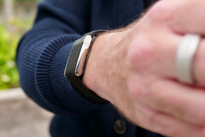 The side of the Whoop 5.0 on a person's wrist.