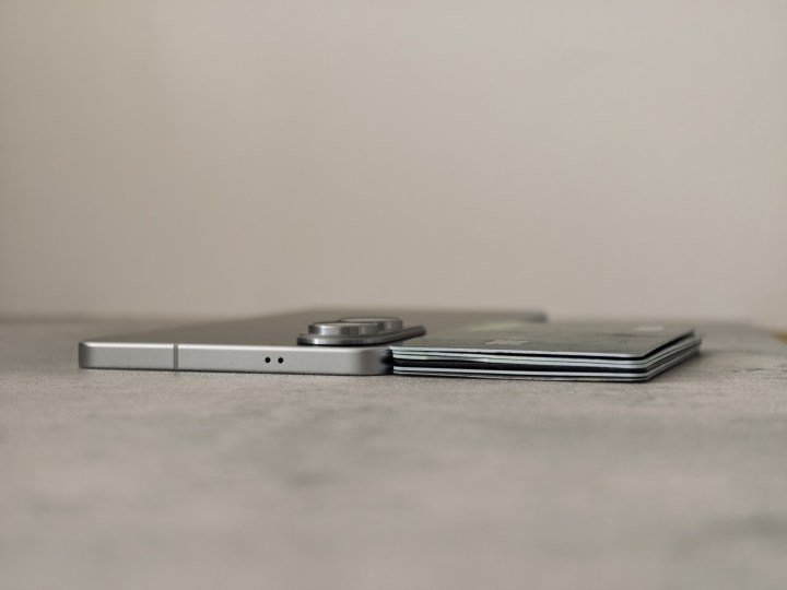 Galaxy S25 Edge next to six stacked credit cards