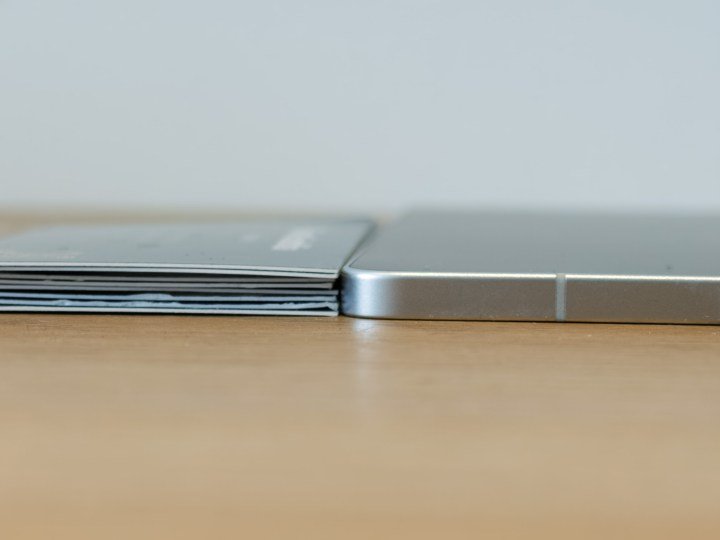 Galaxy S25 Edge next to several business cards stacked