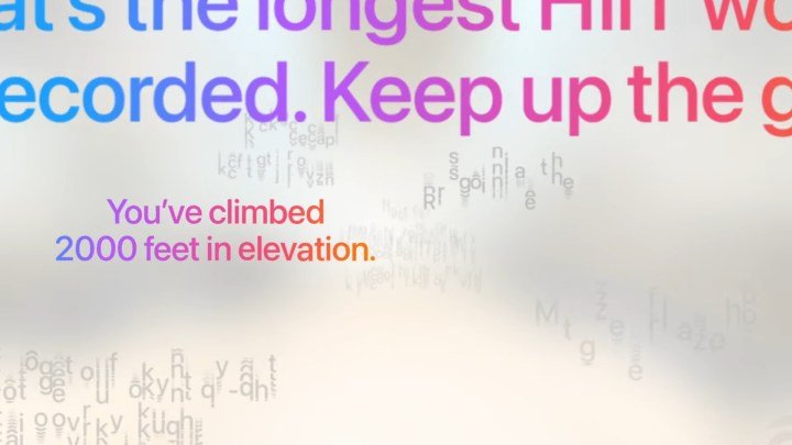 WWDC 2025 keynote screenshot showing Workout Buddy motivational phrases in WatchOS 26