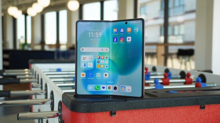 The internal screen of the Magic V5, standing on the edge of a foosball table