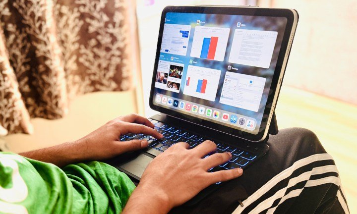 ESR Rebound Magnetic keyboard for the iPad on a person's lap.