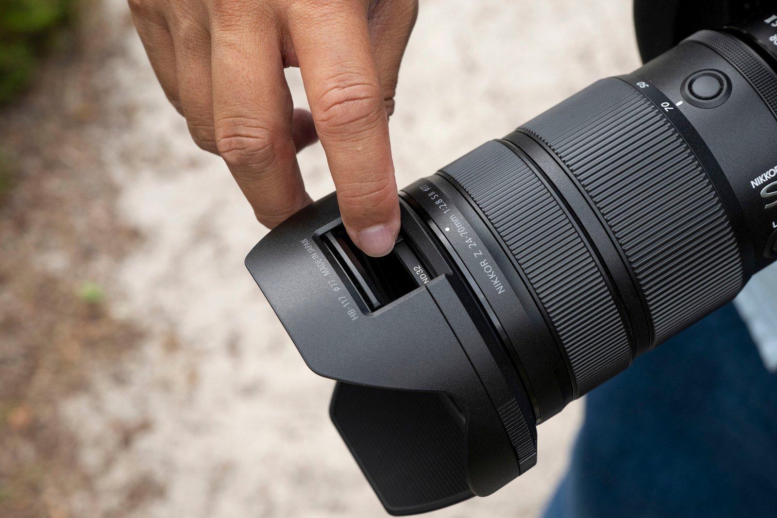 Nikon Z 24-70mm f/2.8 S II lens in the hand